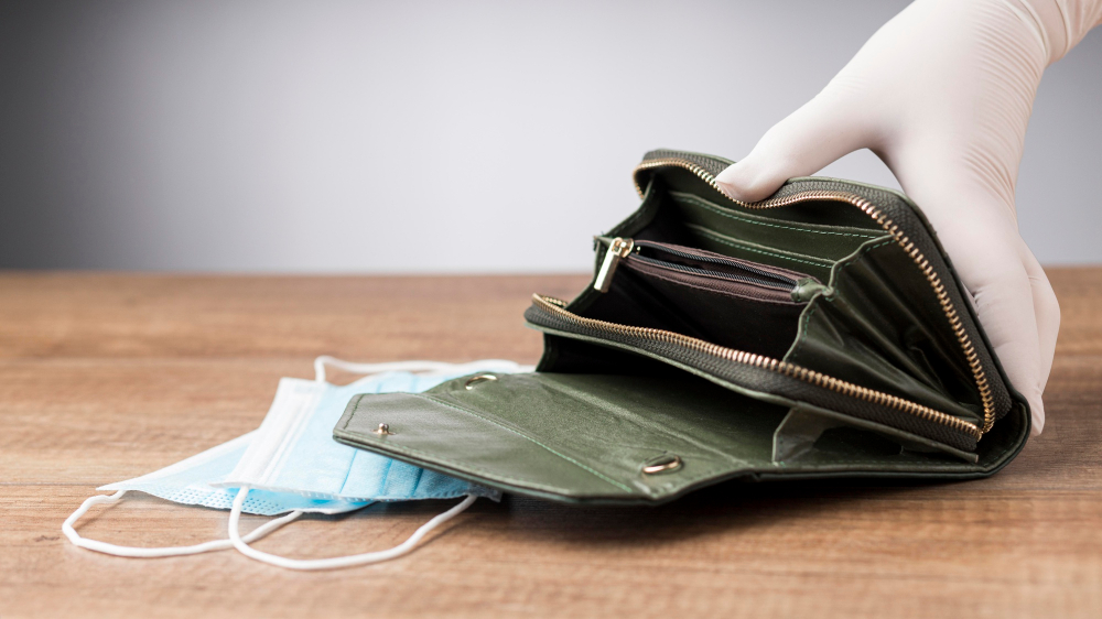 woman holding an empty wallet