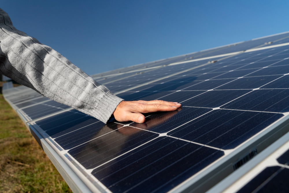 A technician making sure the solar panels are maintained