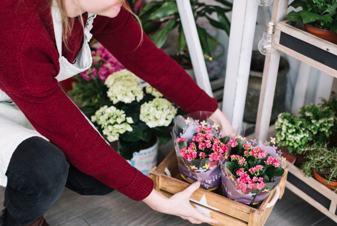 woman arranging flowers for online delivery in KL