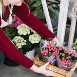 woman arranging flowers for online delivery in KL