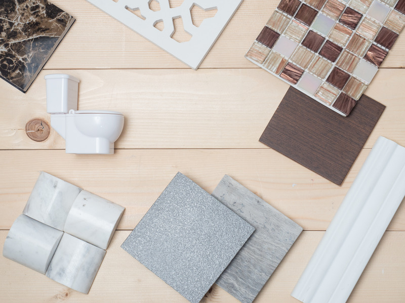 Bathroom wall and floor tile design along with other materials displayed, featuring various colors and textures.